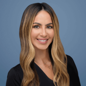 Woman Smiling Against Blue Background
