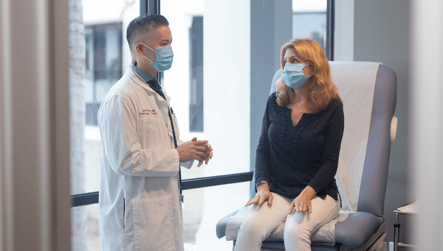 Physician Talks with Patient