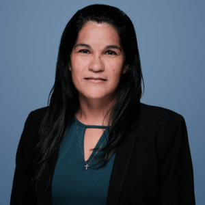 Woman's Headshot against Blue Background
