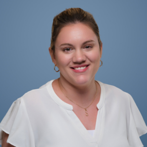 woman smiling against blue background