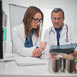 Two doctors checking a report